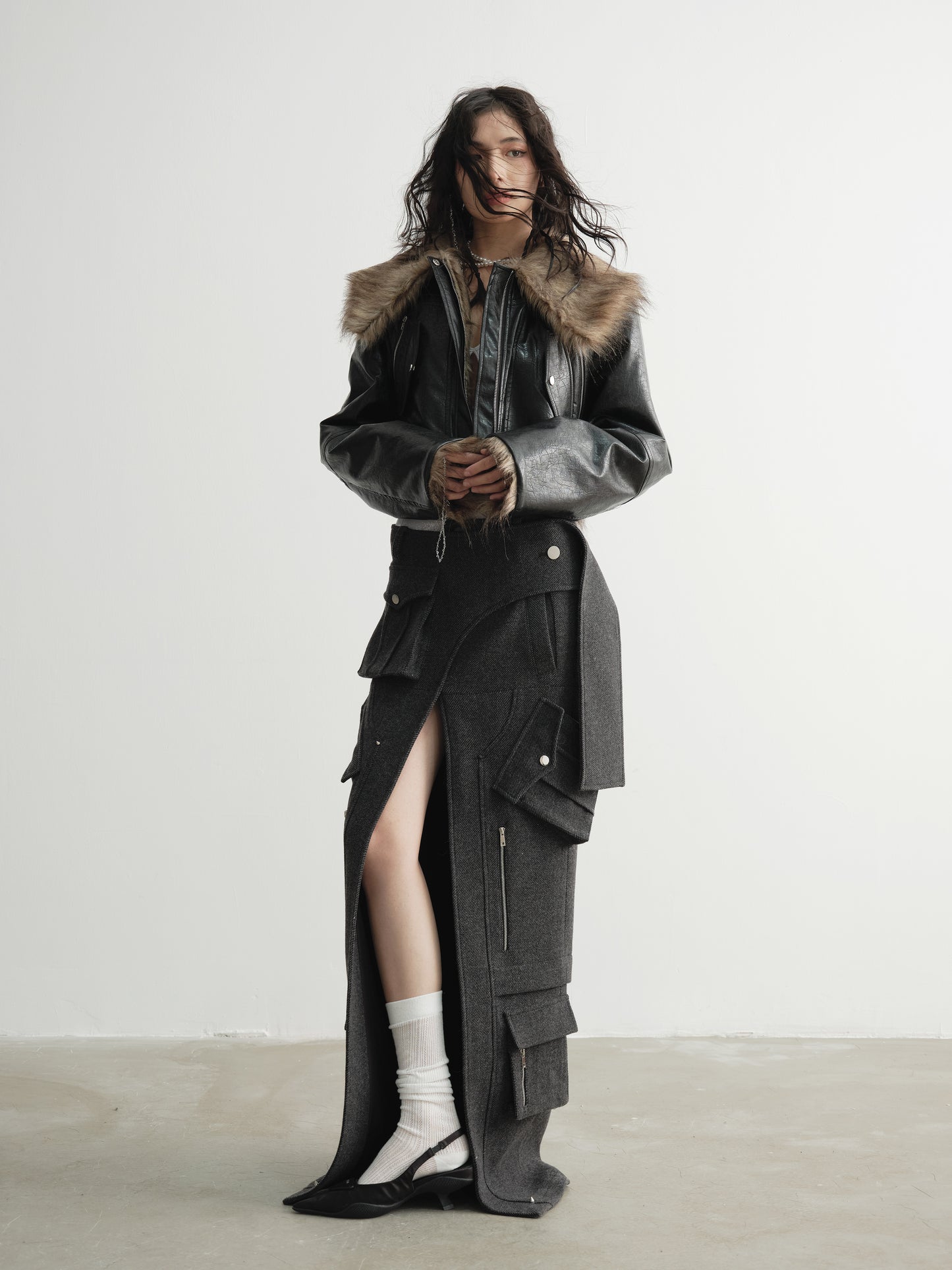 Model wearing Ara Ato's reversible Alix Jacket with the black leather side on the exterior and brown fur side on the interior.