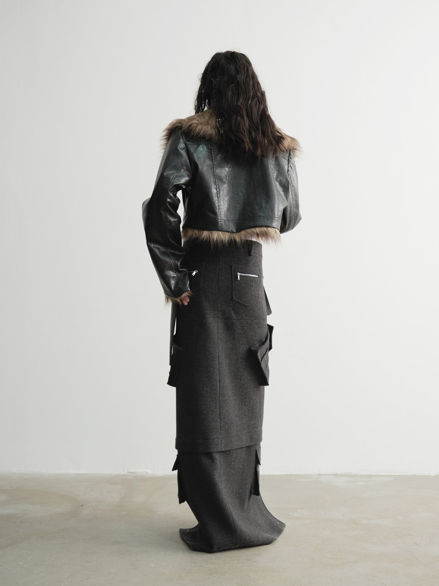 Back angle view of Ara Ato's reversible Alix Jacket with the black leather side on the exterior and brown fur side on the interior.